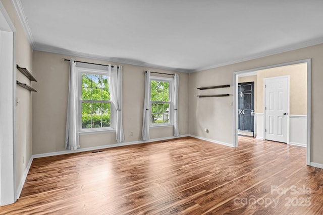101 Wynnchester Rd, Gastonia, NC 28056 - unfurnished room featuring crown molding, baseboards, wood finished floors, and visible vents