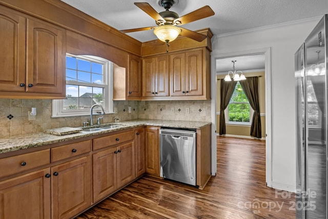 101 Wynnchester Rd, Gastonia, NC 28056 - kitchen featuring light stone countertops, appliances with stainless steel finishes, a sink, dark wood-type flooring, and ornamental molding