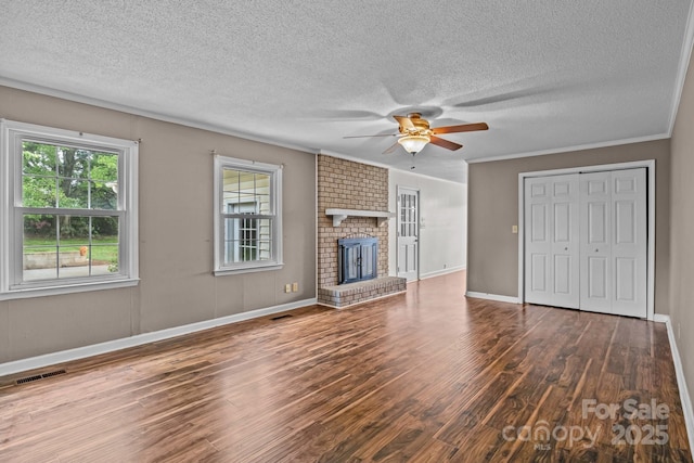 101 Wynnchester Rd, Gastonia, NC 28056 - unfurnished living room featuring a textured ceiling, a ceiling fan, wood finished floors, and visible vents