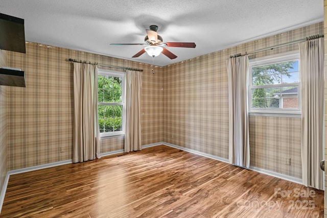101 Wynnchester Rd, Gastonia, NC 28056 - spare room featuring baseboards, a ceiling fan, a textured ceiling, and wood finished floors