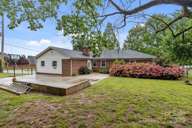 101 Wynnchester Rd, Gastonia, NC 28056 - rear view of house with a chimney, a yard, a patio area, and brick siding