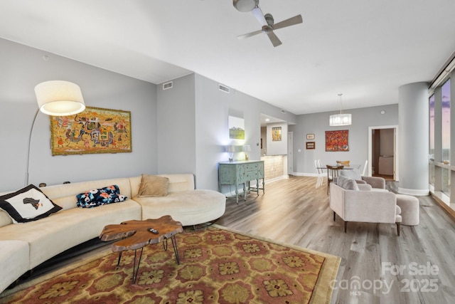315 Arlington Ave Unit 1104, Charlotte, NC 28203 - living area with wood finished floors, ceiling fan, visible vents, and baseboards