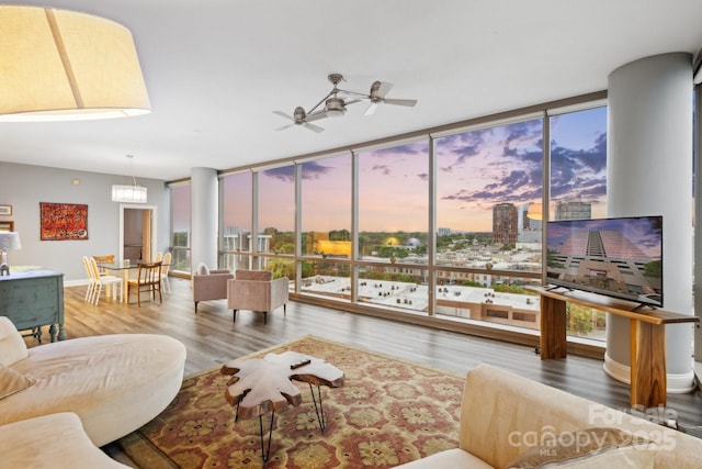 315 Arlington Ave Unit 1104, Charlotte, NC 28203 - living area with baseboards, wood finished floors, a ceiling fan, and a wall of windows