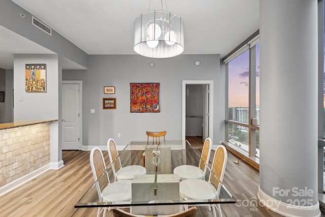 315 Arlington Ave Unit 1104, Charlotte, NC 28203 - dining area featuring wood finished floors and visible vents
