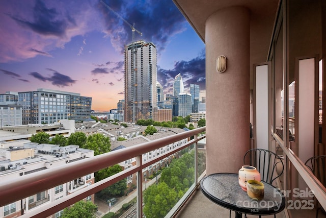 315 Arlington Ave Unit 1104, Charlotte, NC 28203 - balcony at dusk featuring a view of city