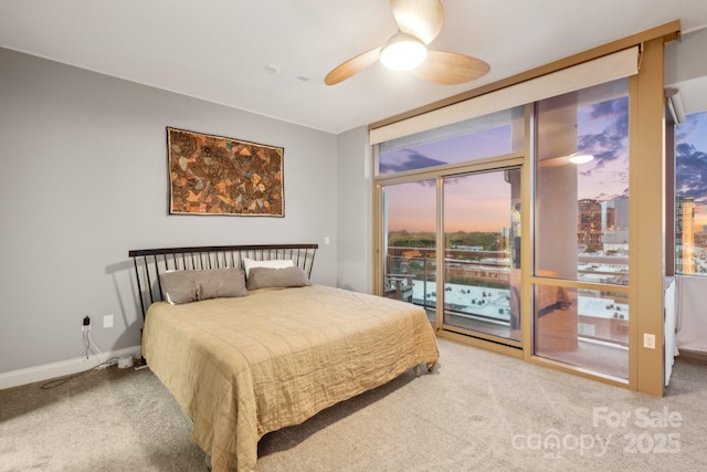 315 Arlington Ave Unit 1104, Charlotte, NC 28203 - bedroom featuring ceiling fan, carpet flooring, access to outside, and baseboards