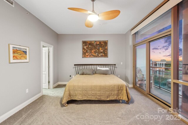 315 Arlington Ave Unit 1104, Charlotte, NC 28203 - bedroom featuring carpet, access to exterior, baseboards, visible vents, and a ceiling fan