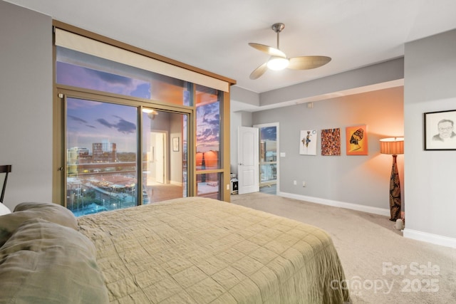 315 Arlington Ave Unit 1104, Charlotte, NC 28203 - carpeted bedroom featuring ceiling fan, access to exterior, and baseboards