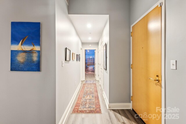 315 Arlington Ave Unit 1104, Charlotte, NC 28203 - hallway featuring baseboards, recessed lighting, and wood finished floors