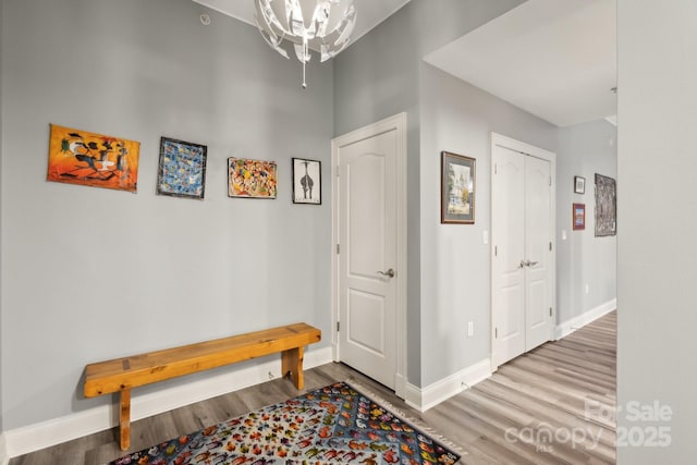 315 Arlington Ave Unit 1104, Charlotte, NC 28203 - entryway featuring wood finished floors, a notable chandelier, and baseboards
