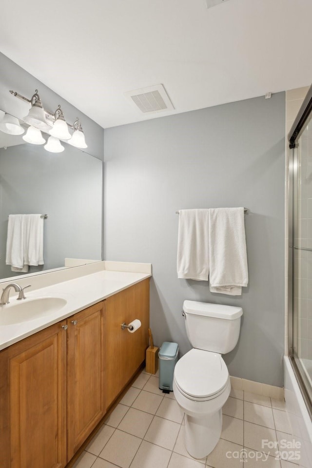 315 Arlington Ave Unit 1104, Charlotte, NC 28203 - full bath featuring tile patterned floors, toilet, visible vents, and vanity