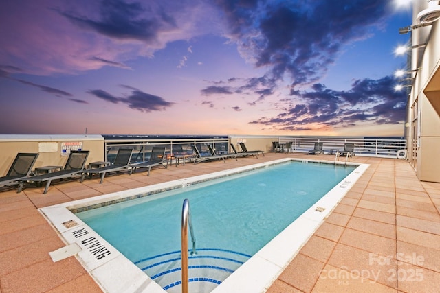 315 Arlington Ave Unit 1104, Charlotte, NC 28203 - pool at dusk with a patio area and a community pool
