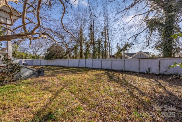 view of yard with a fenced backyard