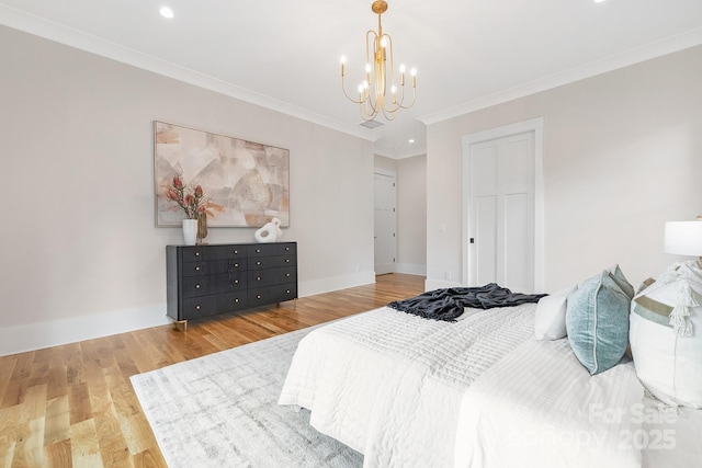 632 Dorothy Dr, Charlotte, NC 28203 - bedroom featuring a chandelier, crown molding, baseboards, wood finished floors, and recessed lighting