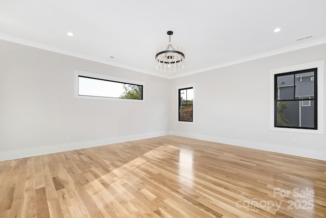 632 Dorothy Dr, Charlotte, NC 28203 - empty room with crown molding, a chandelier, light wood-style floors, baseboards, and recessed lighting