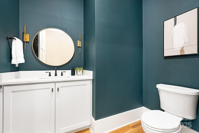 632 Dorothy Dr, Charlotte, NC 28203 - bathroom featuring toilet, vanity, and wood finished floors