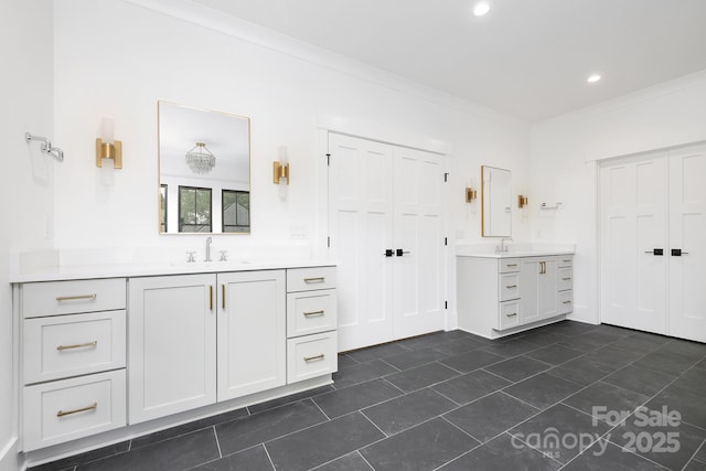 632 Dorothy Dr, Charlotte, NC 28203 - bathroom with two vanities, tile patterned flooring, recessed lighting, and ornamental molding