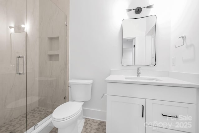 632 Dorothy Dr, Charlotte, NC 28203 - full bath with a marble finish shower, toilet, baseboards, and vanity