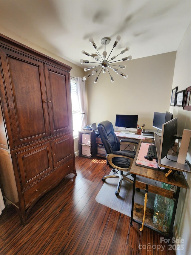 office space featuring baseboards, dark wood-style flooring, and a notable chandelier