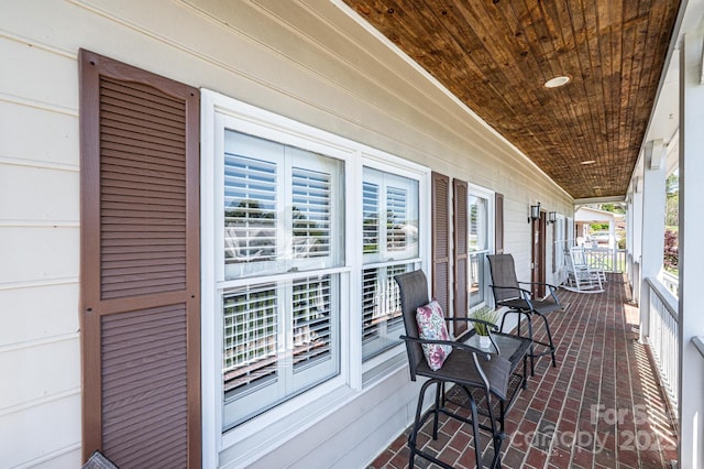 5933 Flintlock Ct, Hickory, NC 28601 - wooden deck featuring covered porch