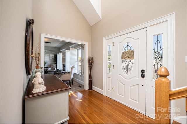 5933 Flintlock Ct, Hickory, NC 28601 - entrance foyer with wood finished floors, baseboards, and high vaulted ceiling
