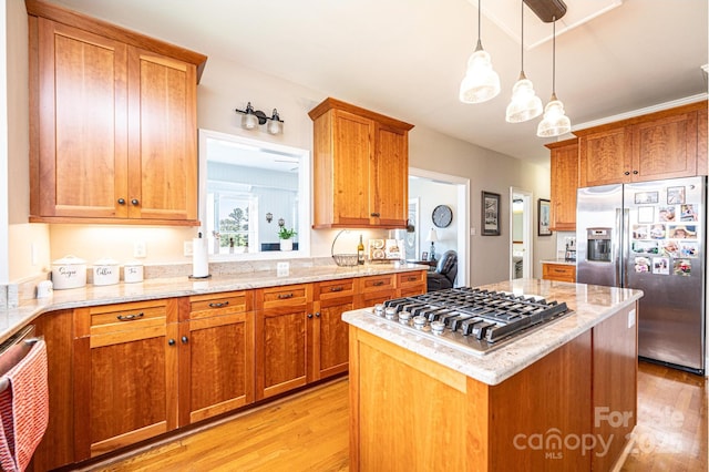 5933 Flintlock Ct, Hickory, NC 28601 - kitchen featuring appliances with stainless steel finishes, light wood finished floors, and light stone countertops
