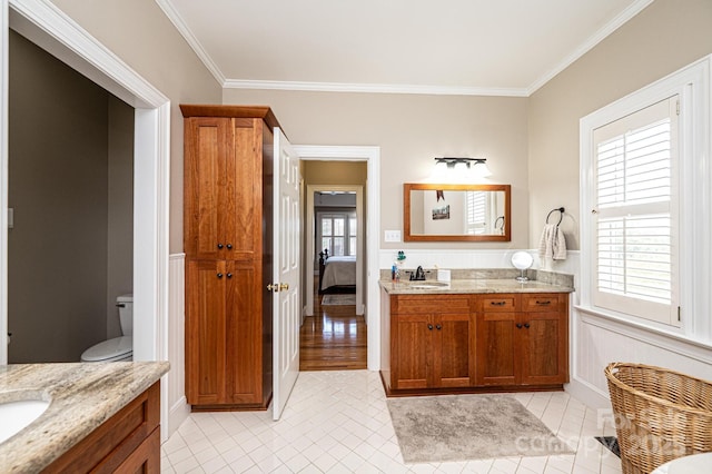 5933 Flintlock Ct, Hickory, NC 28601 - ensuite bathroom featuring vanity, crown molding, tile patterned flooring, and toilet