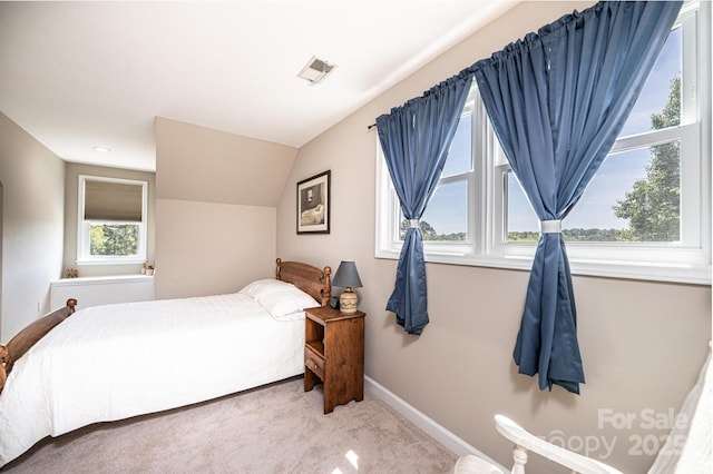 5933 Flintlock Ct, Hickory, NC 28601 - carpeted bedroom featuring vaulted ceiling and baseboards