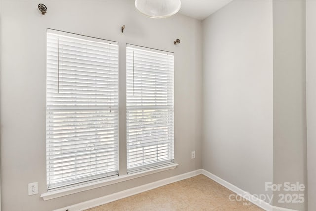 empty room with baseboards