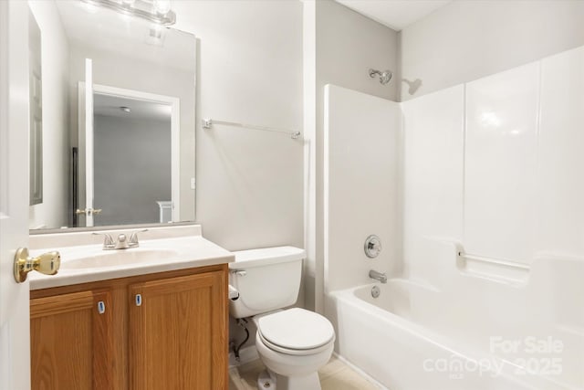 bathroom featuring vanity, washtub / shower combination, and toilet