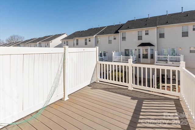 wooden deck with a residential view