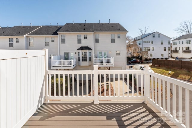 wooden deck featuring a residential view