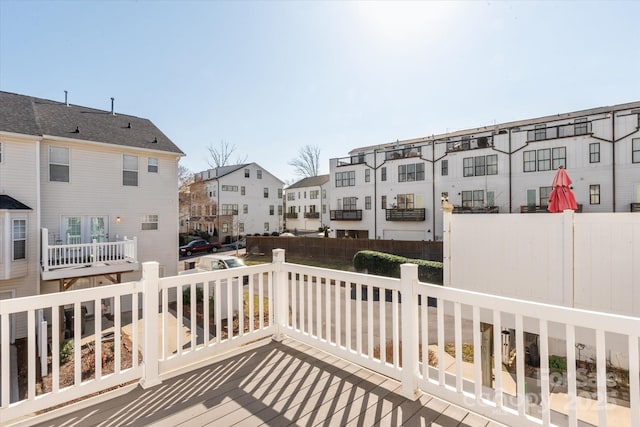 view of wooden balcony with a wooden deck and a residential view