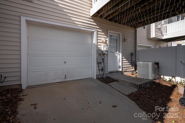 exterior space featuring central air condition unit and fence