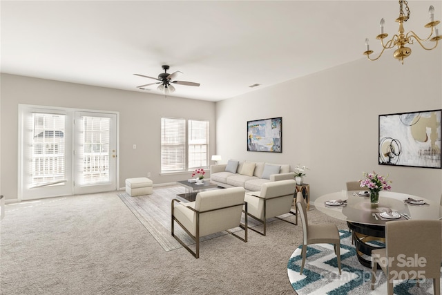 8177 Millwright Ln, Charlotte, NC 28277 - living area with light carpet and ceiling fan with notable chandelier