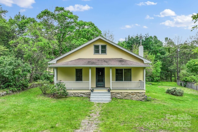 443 Ox Creek Rd, Weaverville, NC 28787 - view of front of property with a porch, a chimney, stucco siding, a front yard, and a shingled roof