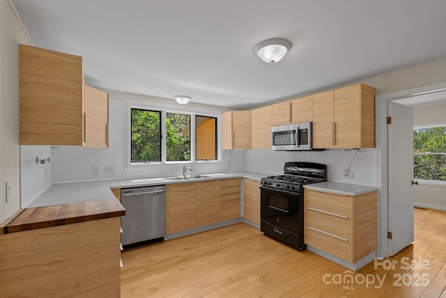 443 Ox Creek Rd, Weaverville, NC 28787 - kitchen with stainless steel appliances, light brown cabinets, light wood finished floors, and light countertops