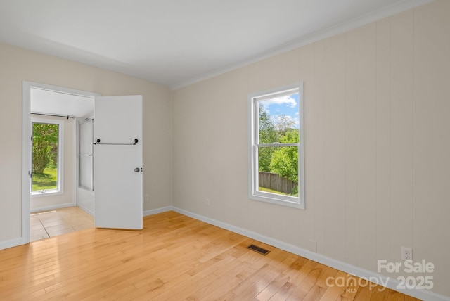 443 Ox Creek Rd, Weaverville, NC 28787 - spare room featuring light wood-type flooring, baseboards, and ornamental molding
