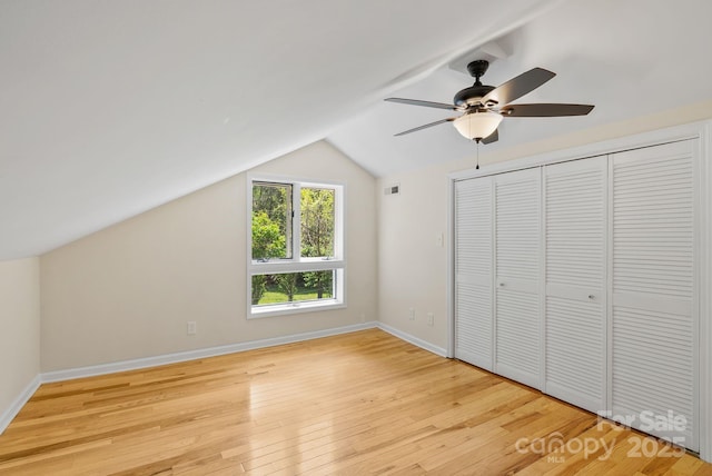 443 Ox Creek Rd, Weaverville, NC 28787 - unfurnished bedroom with lofted ceiling, light wood-type flooring, baseboards, and ceiling fan