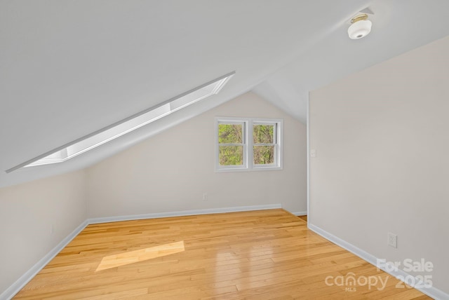 443 Ox Creek Rd, Weaverville, NC 28787 - additional living space featuring a skylight, wood finished floors, lofted ceiling, and baseboards