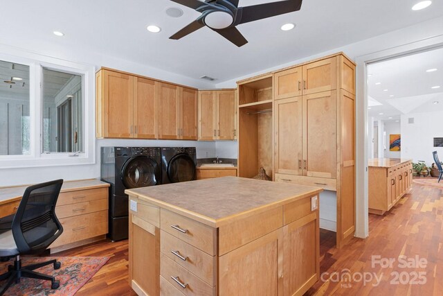 office space featuring a ceiling fan, wood finished floors, a sink, separate washer and dryer, and recessed lighting