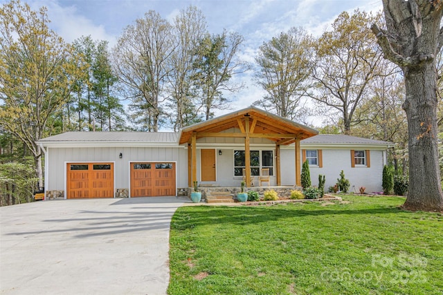 view of front of house featuring board and batten siding, a porch, a garage, driveway, and a front lawn