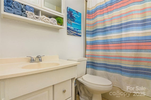 full bathroom with vanity, toilet, and a shower with shower curtain