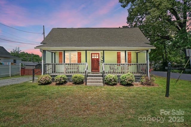 139 5th St, Huntersville, NC 28078 - cape cod house with covered porch, asphalt driveway, and a shingled roof