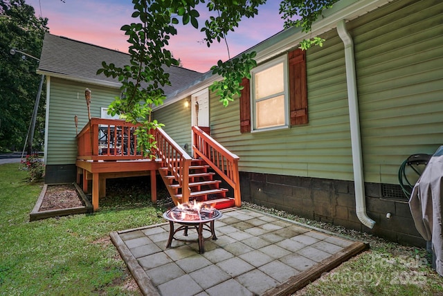 139 5th St, Huntersville, NC 28078 - back of property at dusk featuring a patio area, a lawn, a deck, and roof with shingles