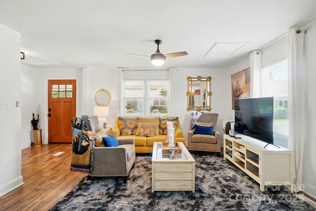 139 5th St, Huntersville, NC 28078 - living room featuring wood finished floors, baseboards, and a ceiling fan