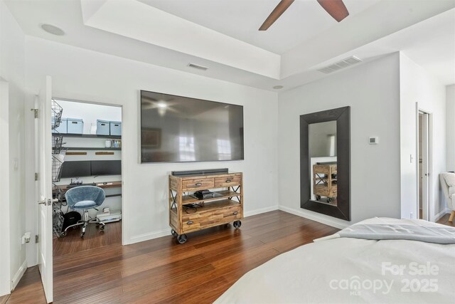 3009 Brooks Mill Ln, Wingate, NC 28174 - bedroom featuring wood finished floors, a desk, a raised ceiling, and baseboards
