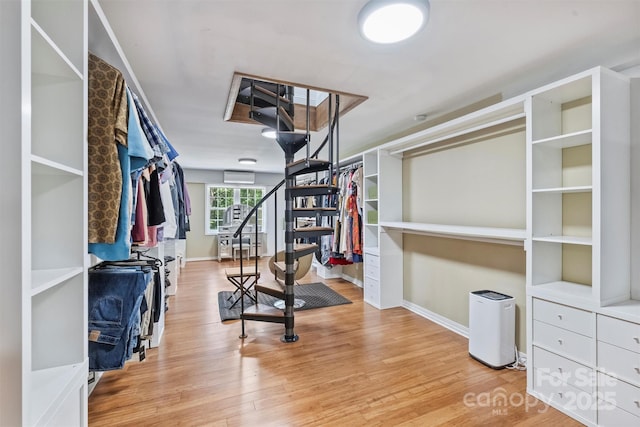 3009 Brooks Mill Ln, Wingate, NC 28174 - spacious closet featuring a wall mounted air conditioner and wood finished floors