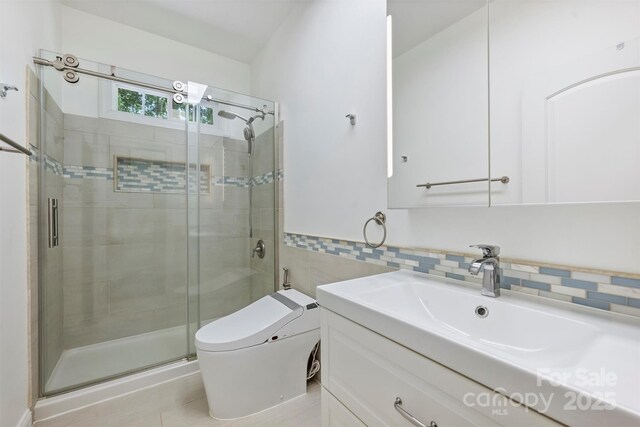 3009 Brooks Mill Ln, Wingate, NC 28174 - full bathroom featuring tile walls, toilet, a stall shower, and vanity