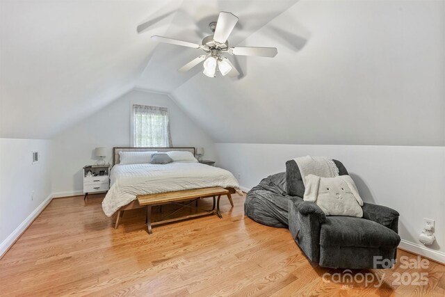 3009 Brooks Mill Ln, Wingate, NC 28174 - bedroom with lofted ceiling, ceiling fan, baseboards, and light wood-style flooring